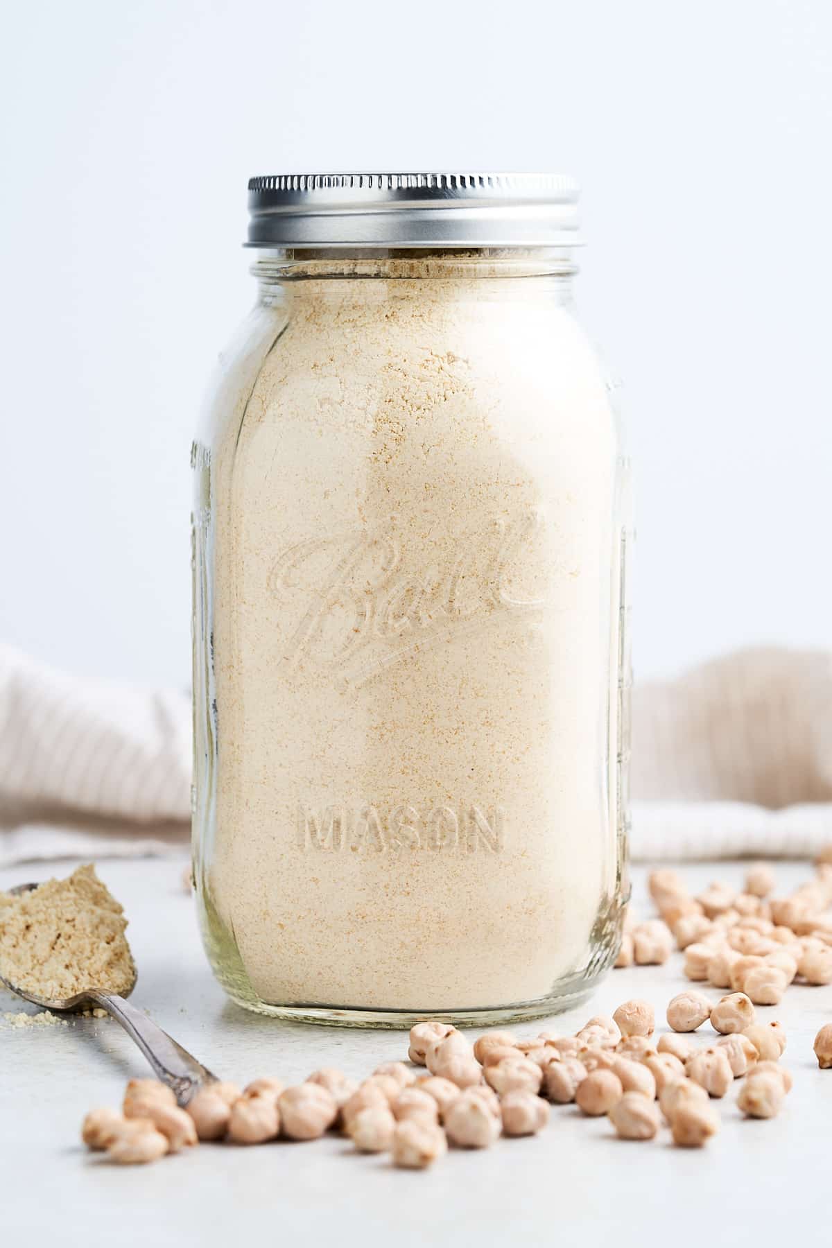 Chickpea flour in a glass mason jar.