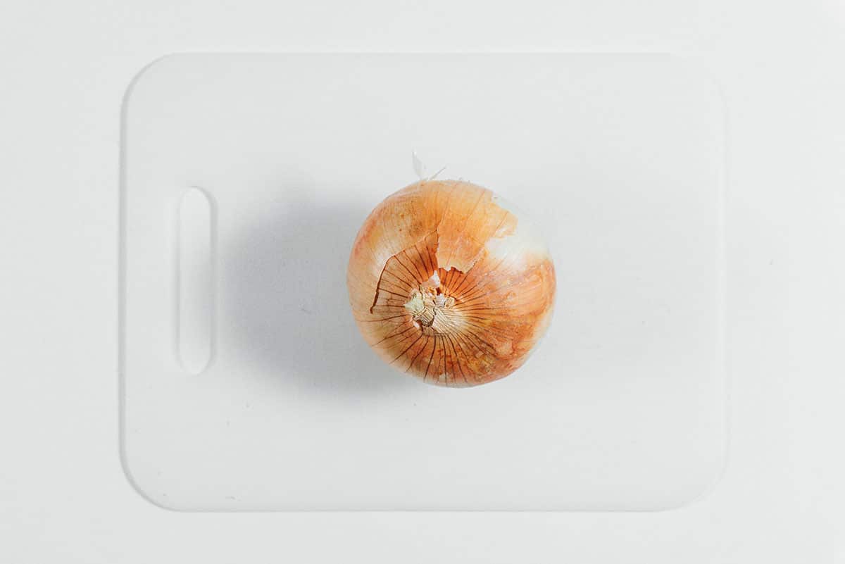 Onion on a cutting board.