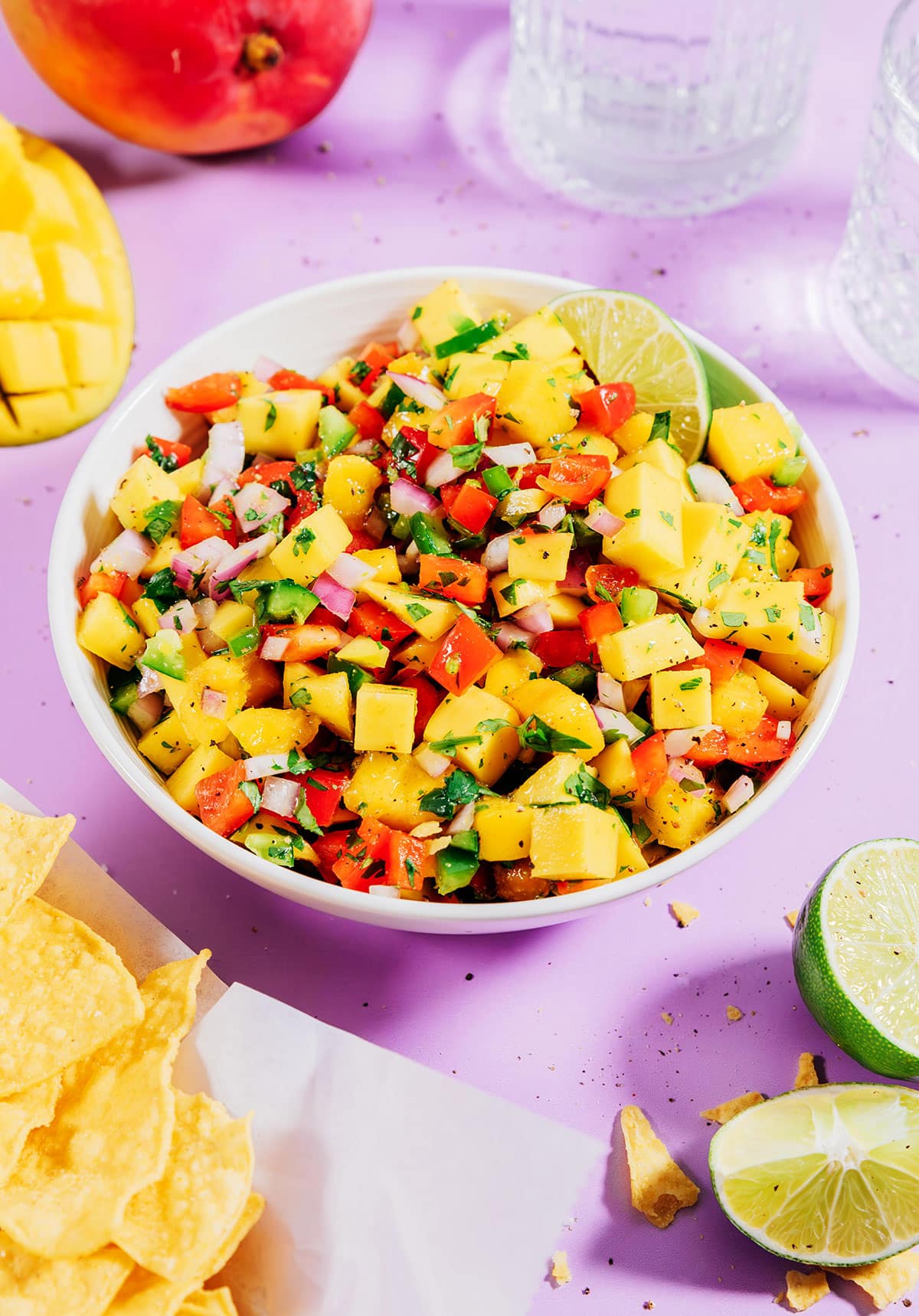 Fresh mango salsa recipe in a bowl with chips from above