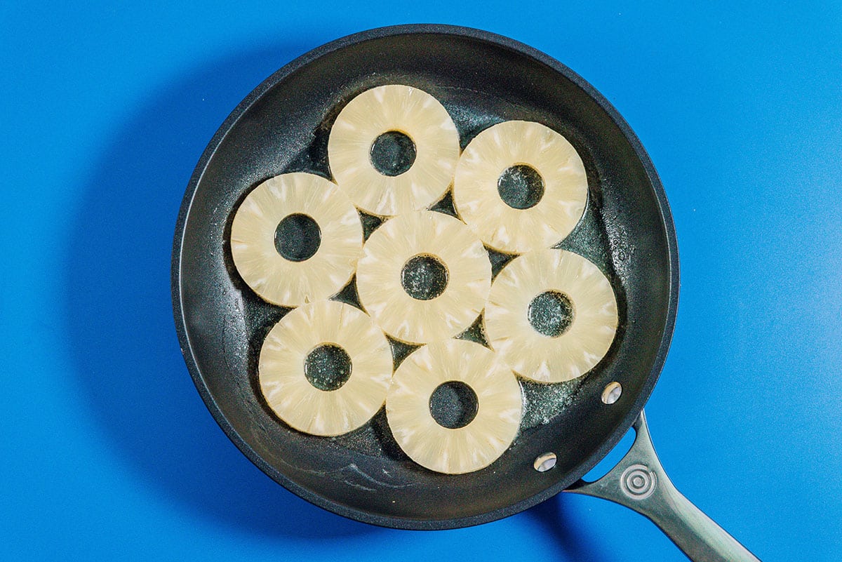 Pineapple rings in a pan.