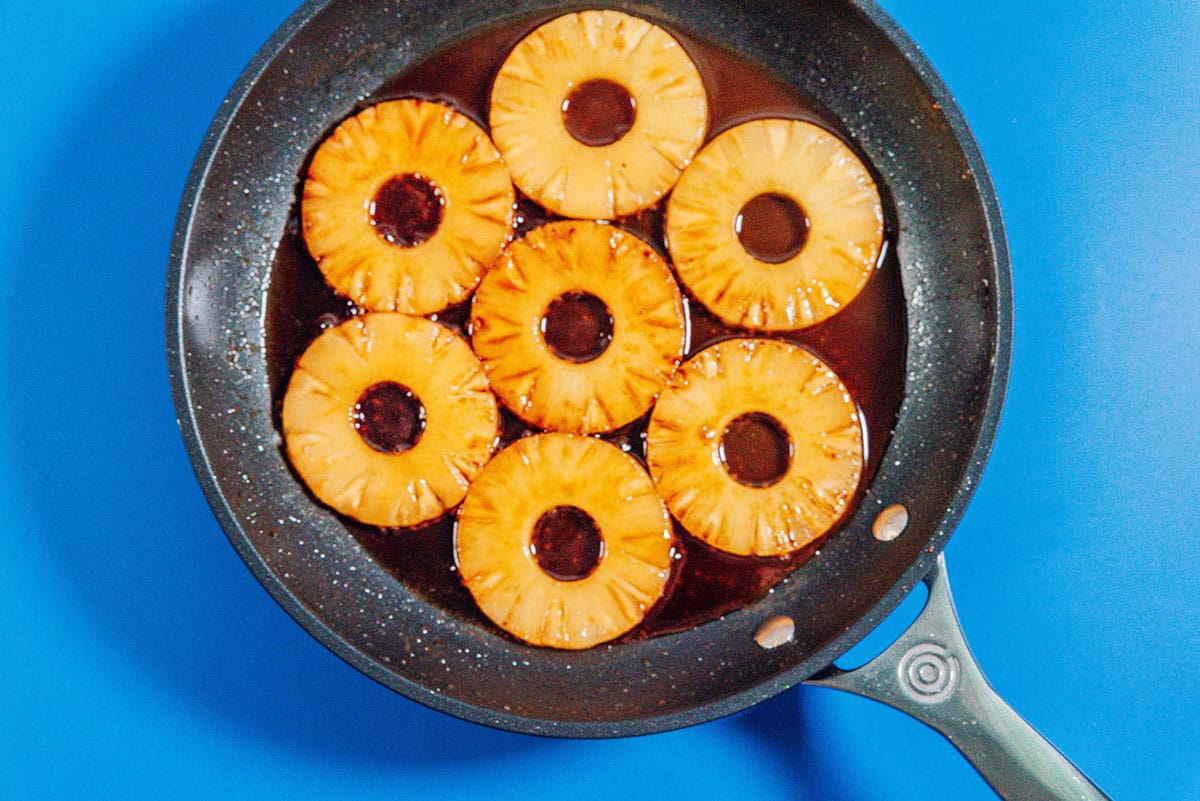 Pineapple rings in a pan.