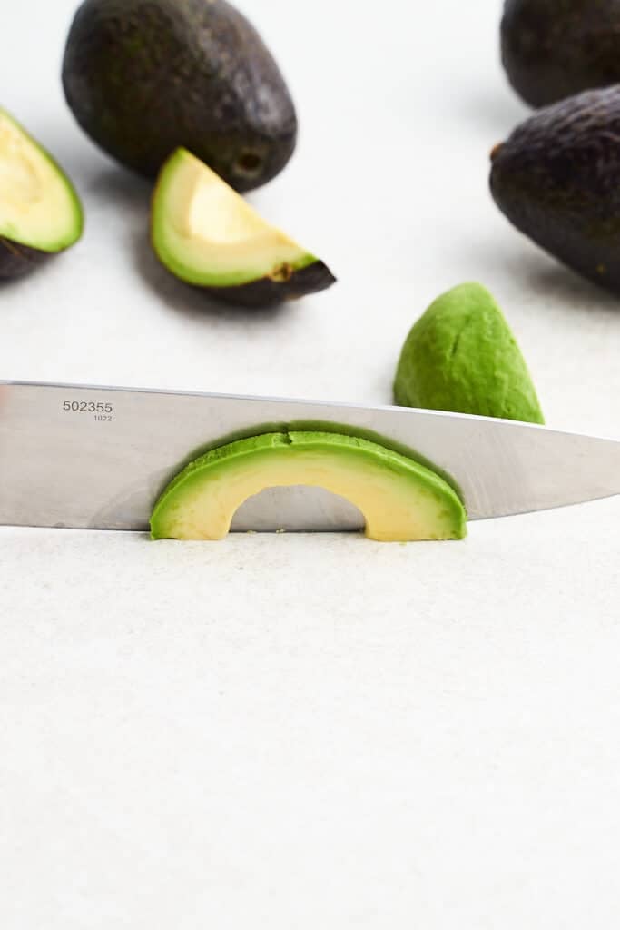 Slicing an avocado.