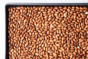 Roasted almonds on a pan.