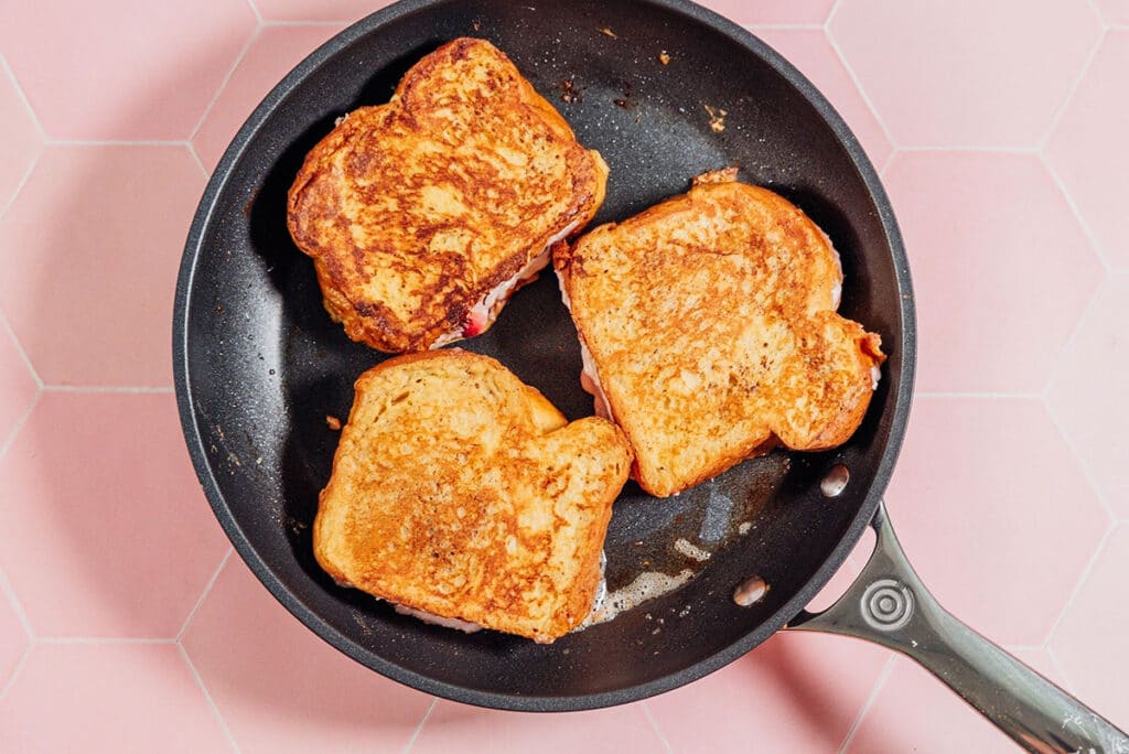 Cooking french toast in a pan.