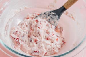 Strawberry cheesecake filling in a bowl.