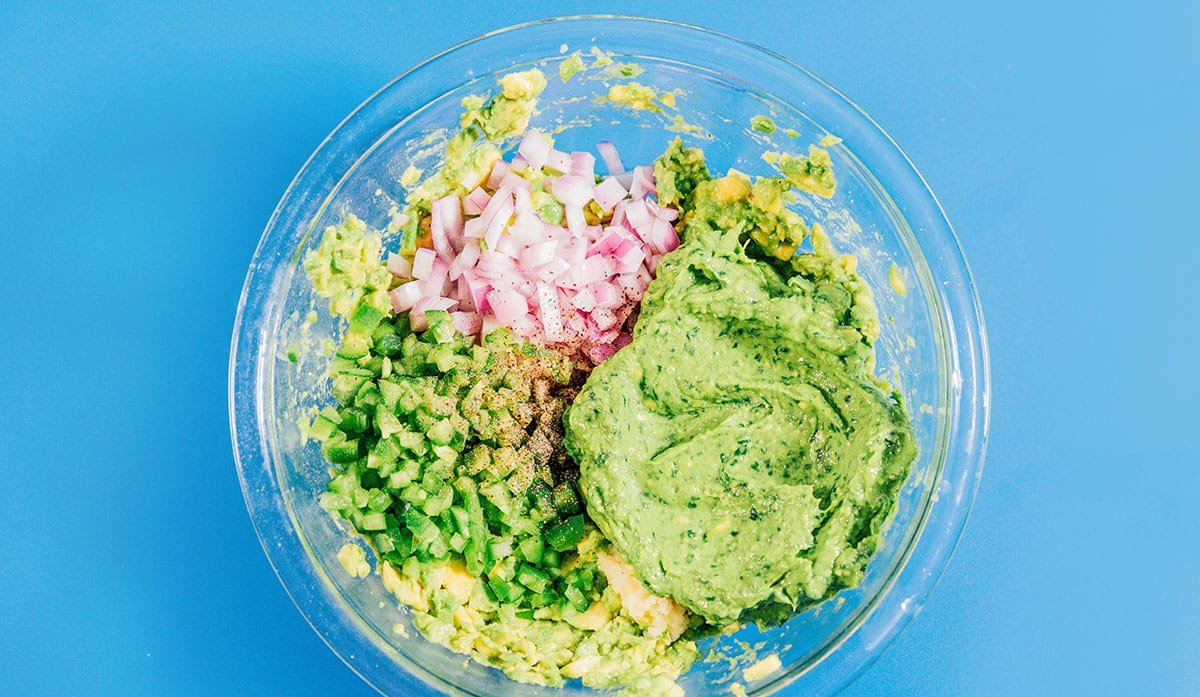 Ingredients for guacamole in a bowl.