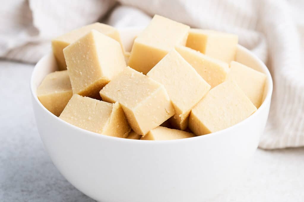Cubes of chickpea tofu in a bowl.