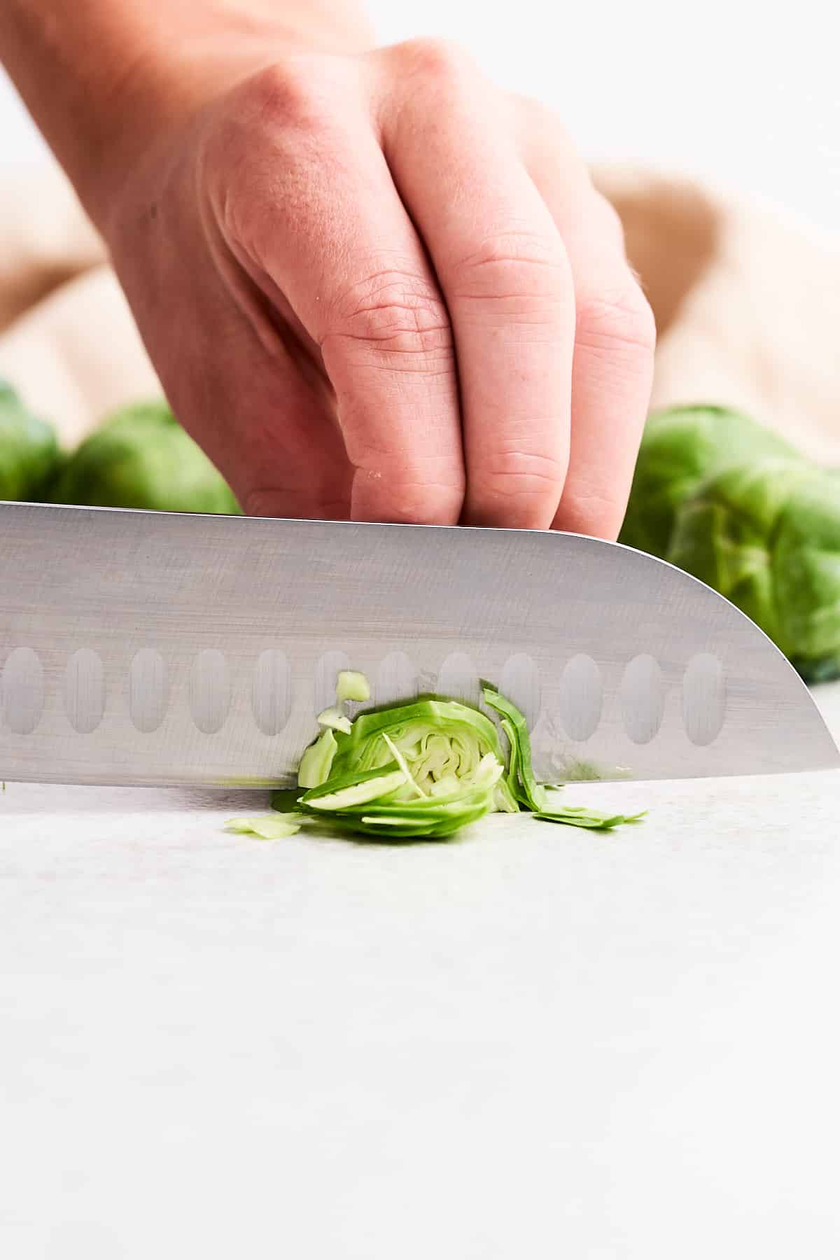 Shredding a Brussels sprout.