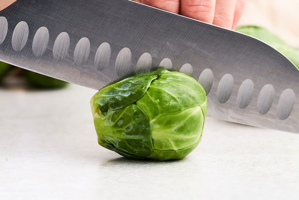 Halving Brussels sprouts.