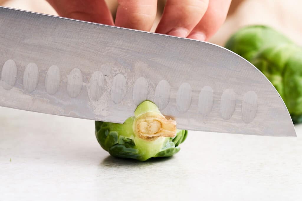 Trimming Brussels sprouts.