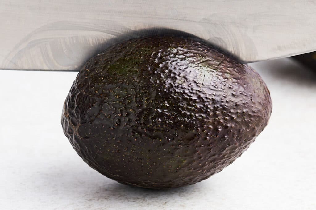 Halving an avocado.