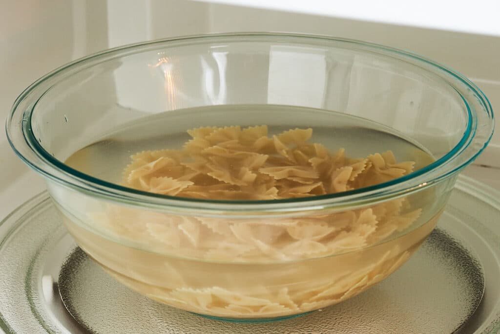 Pasta in a bowl in the microwave.