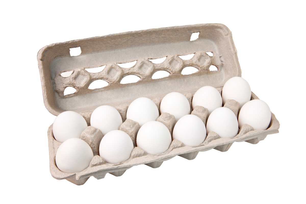 White chicken eggs in a dozen carton.