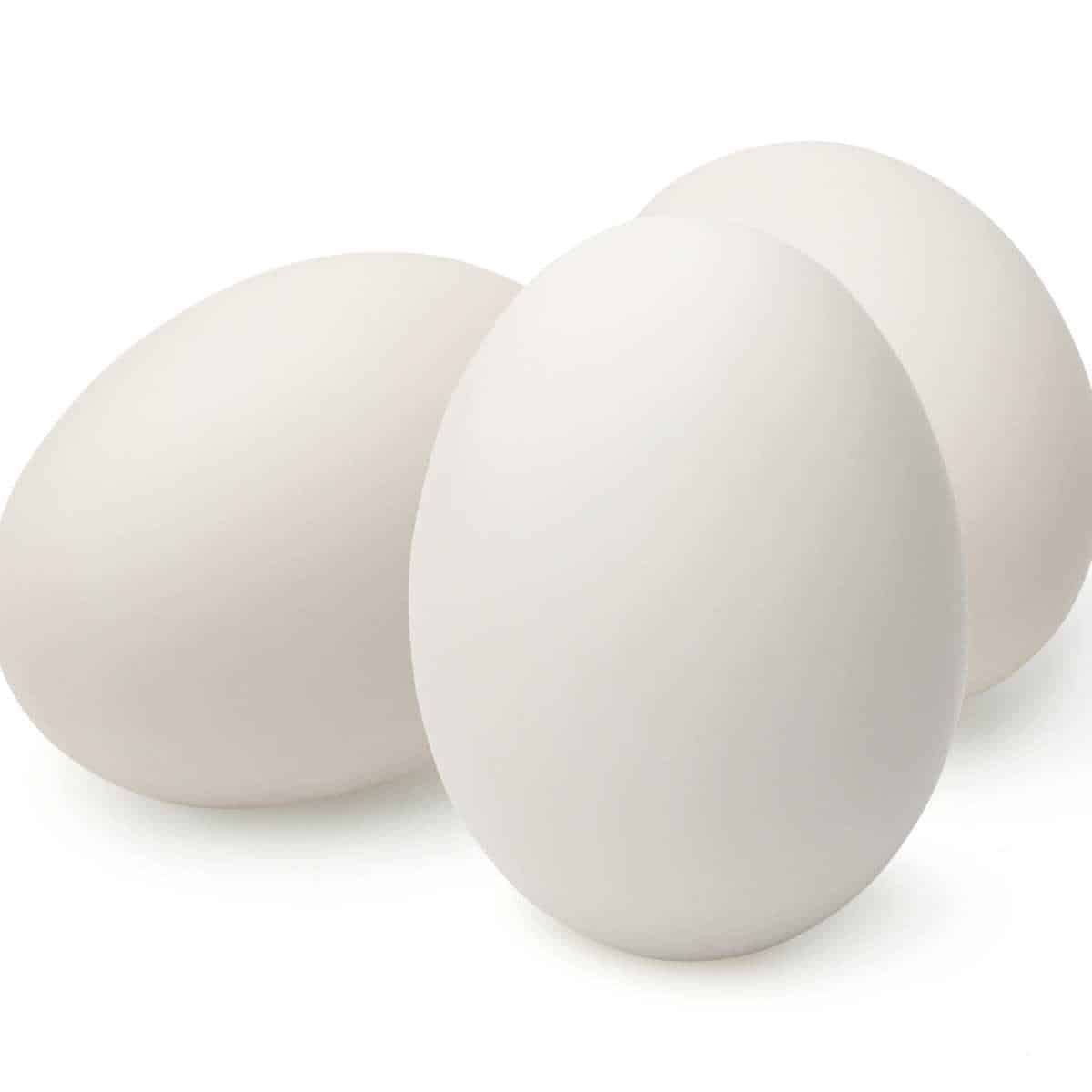 Three duck eggs on a white background.