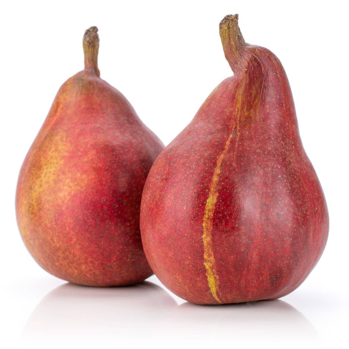 Stark crimson pears on a white background.