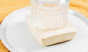 Cutting tofu into circles.