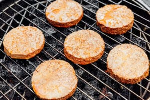 Grilling tofu burgers.