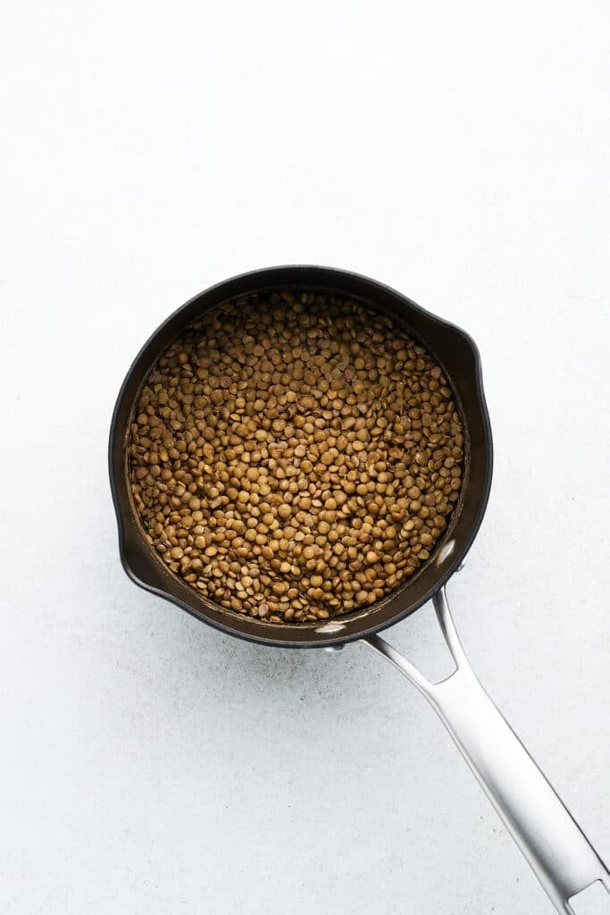Cooked lentils in a pot.