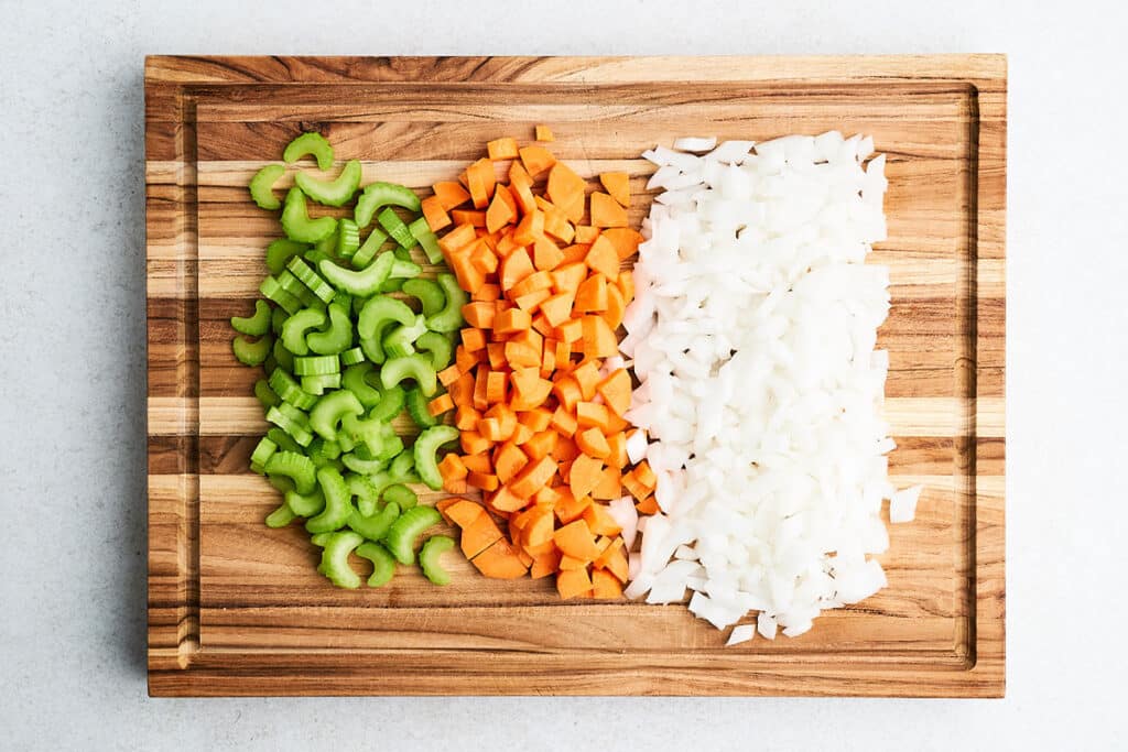Cutting vegetables for mirepoix.