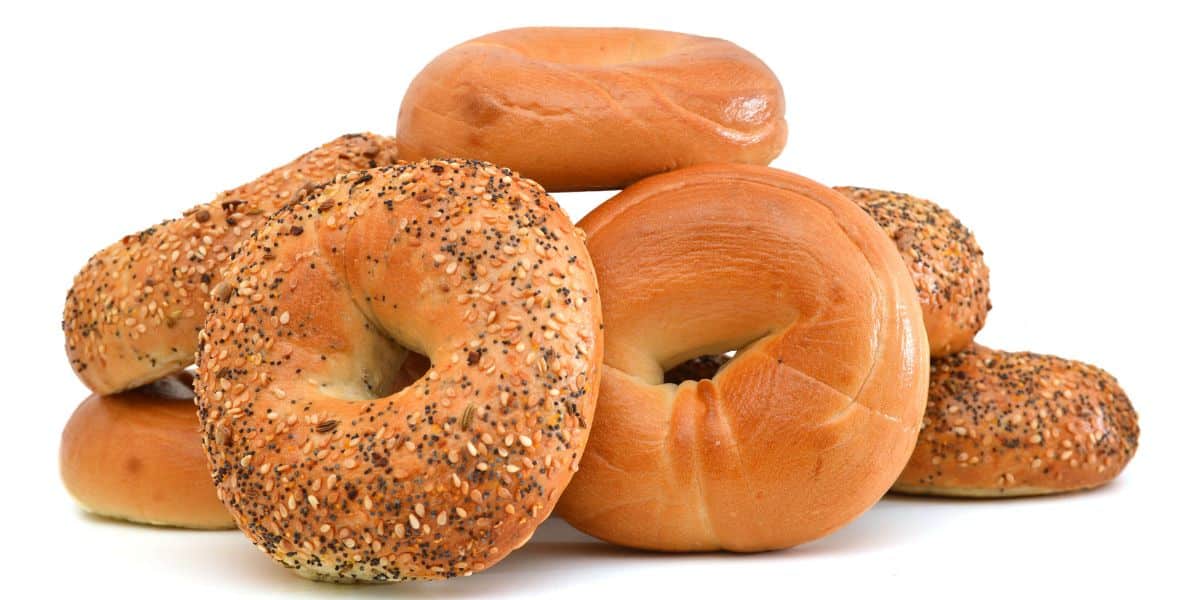 Many bagels on a white background.