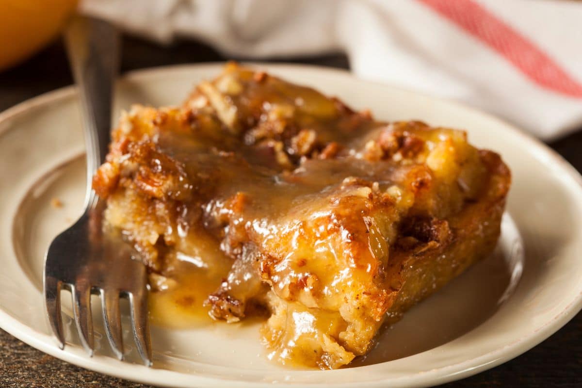 A slice of bread pudding on a plate.