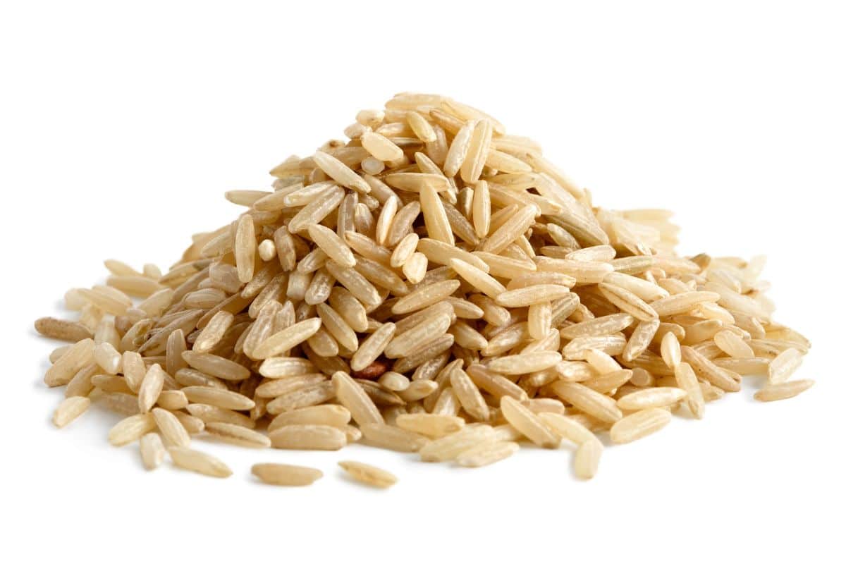 Brown rice on an isolated white background.