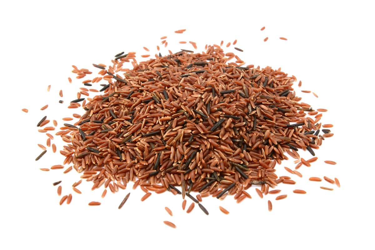 Camargue red rice on an isolated white background.