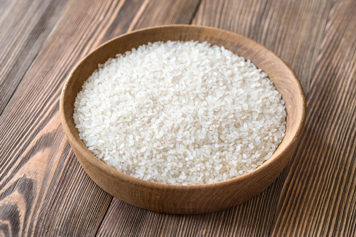 Egyptian rice in a bowl on a wood table.
