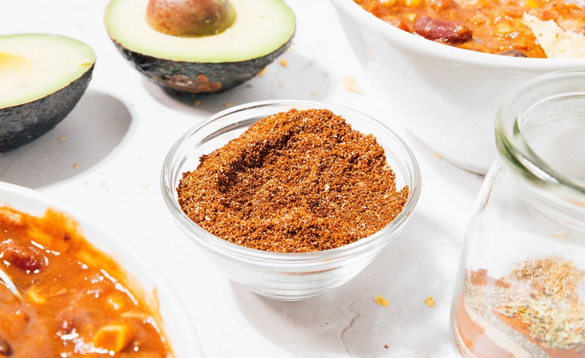 Chili seasoning in a glass bowl.