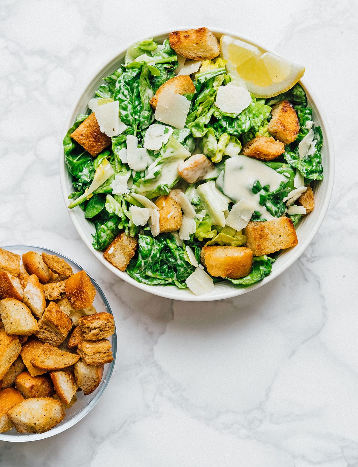 Salad on a marble background with homemade croutons