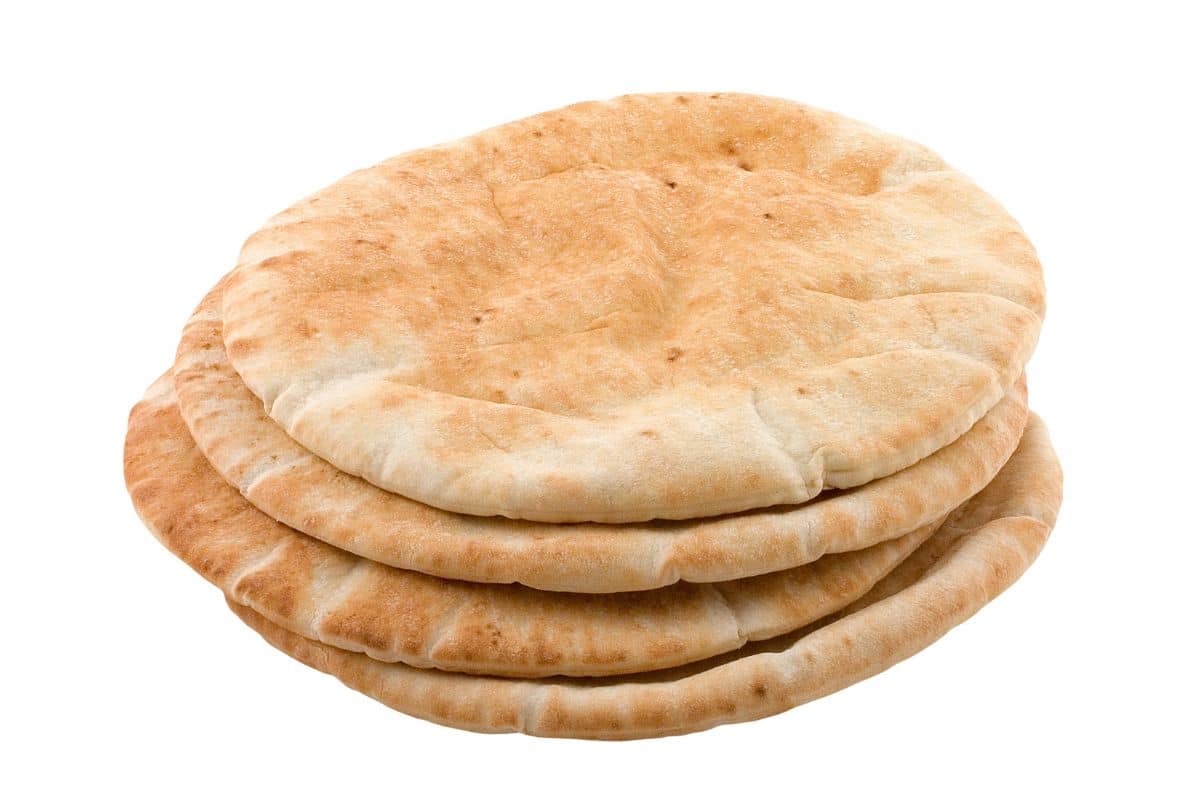 Pita bread stack on a white background.