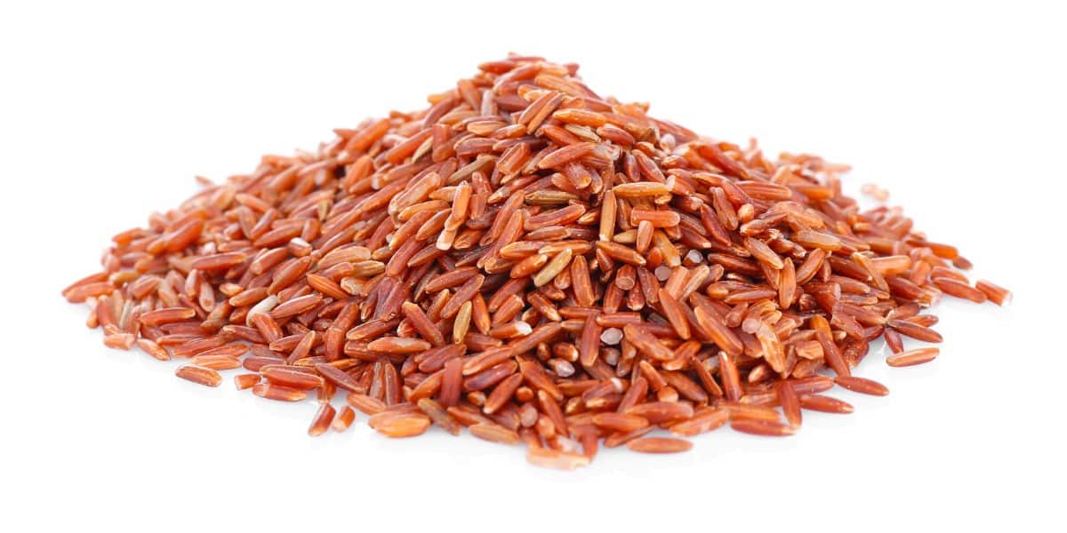 Red cargo rice on an isolated white background.