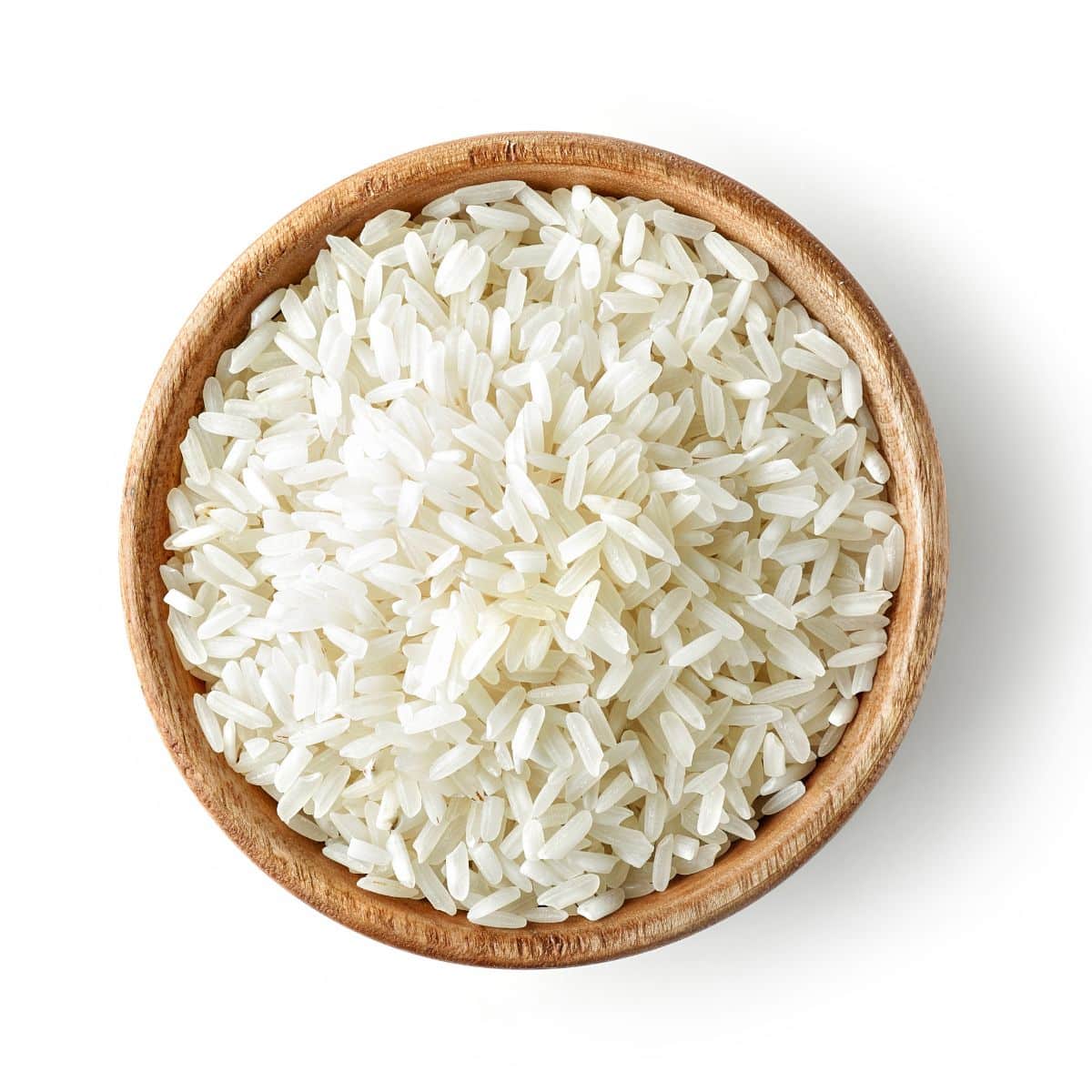 Wehani rice in a wood bowl n a white background.