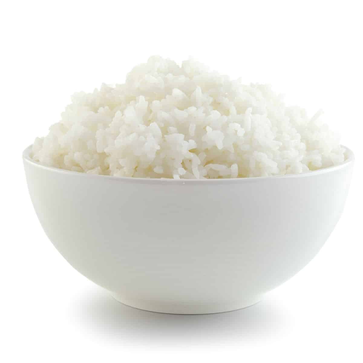 White rice in a bowl on a white background.