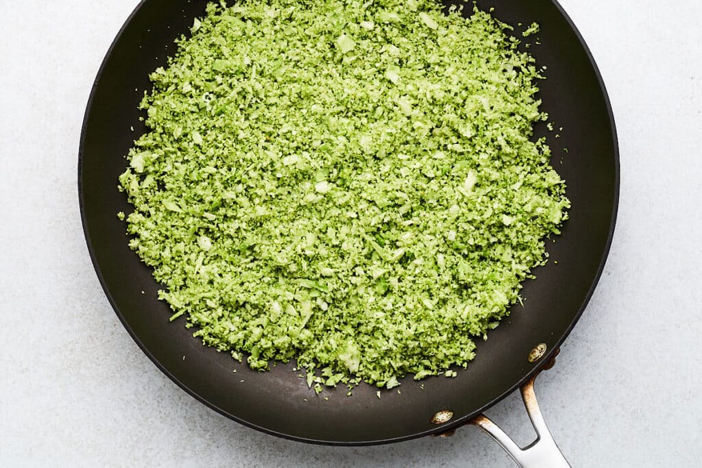 Cooking riced broccoli.