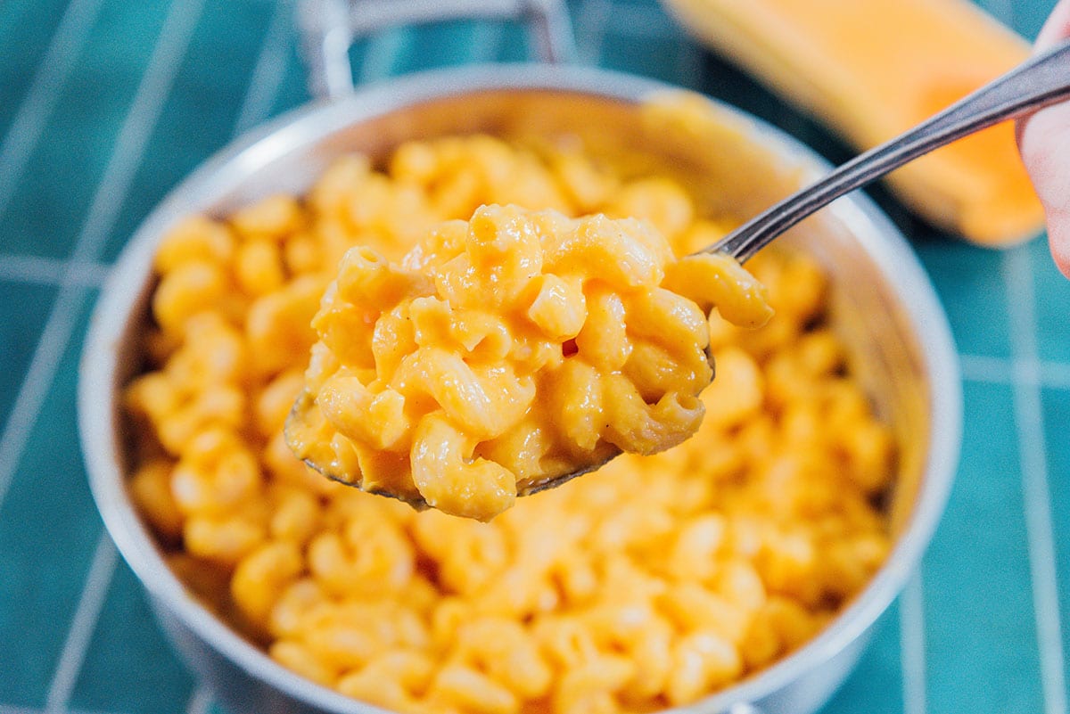 Butternut squash mac and cheese on a spoon.