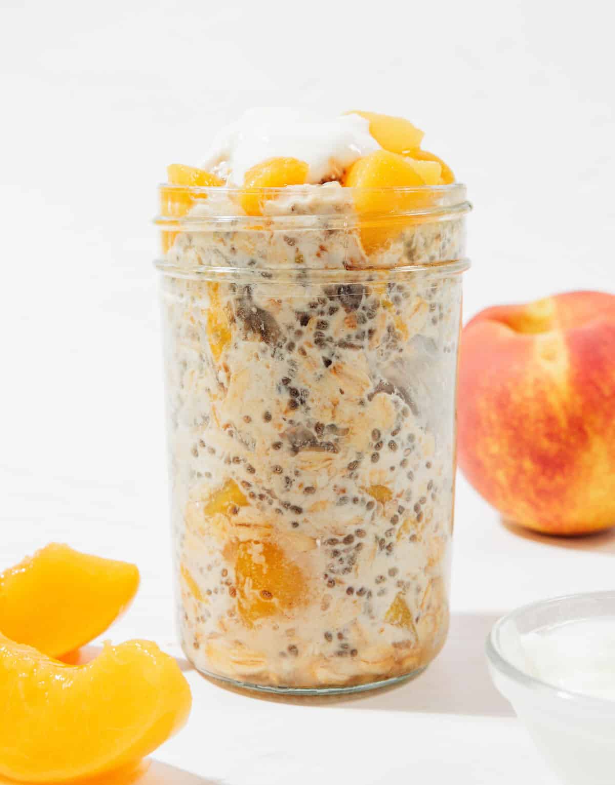 Peach overnight oats in a jar.