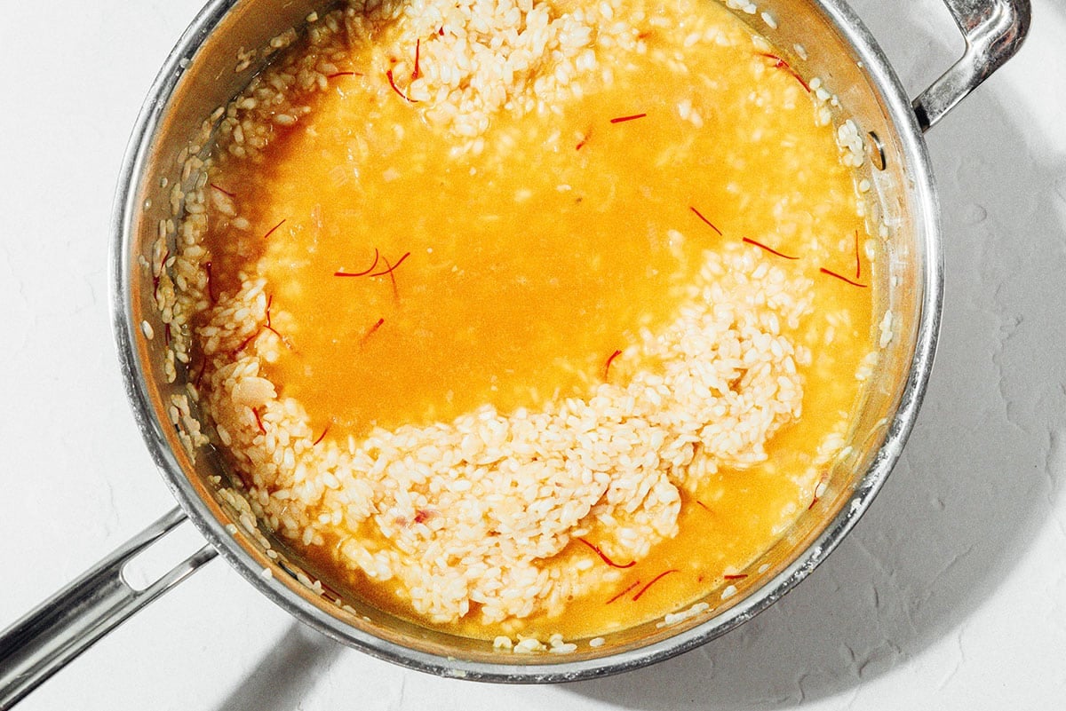 Saffron risotto in a pot.