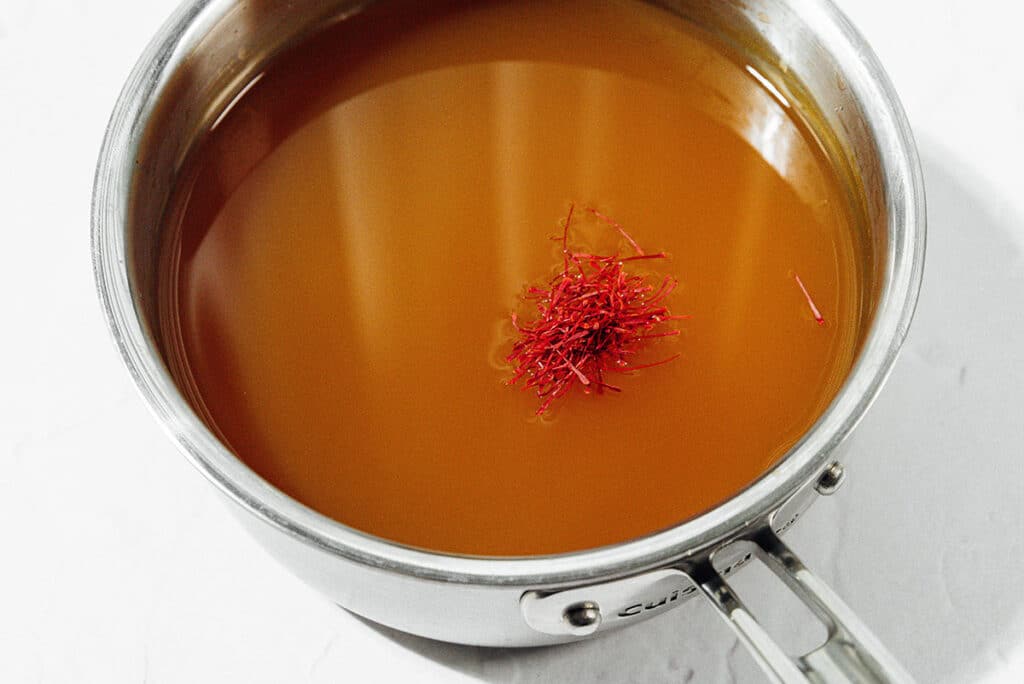 Saffron in broth in a pot.