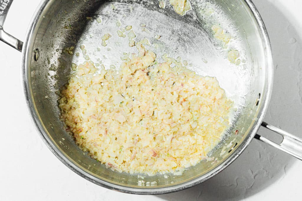 Shallots and garlic in a pan.
