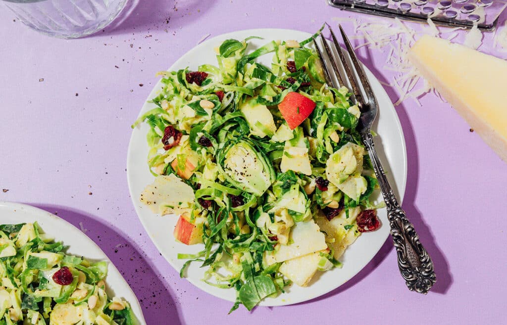 Shredded Brussels sprout salad on a plate.