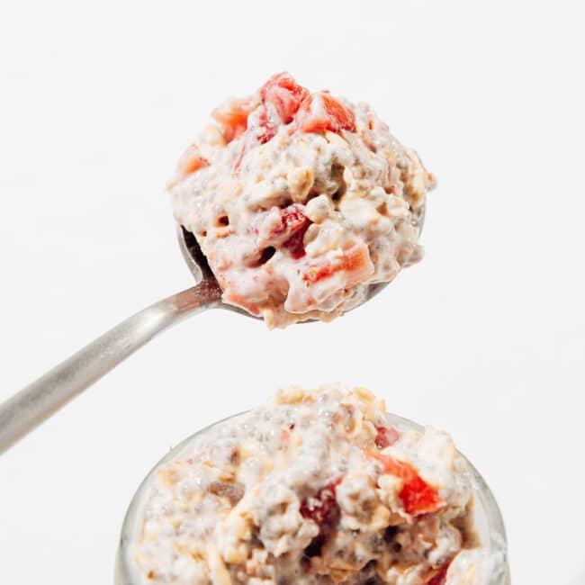 Spoon of strawberry overnight oats.