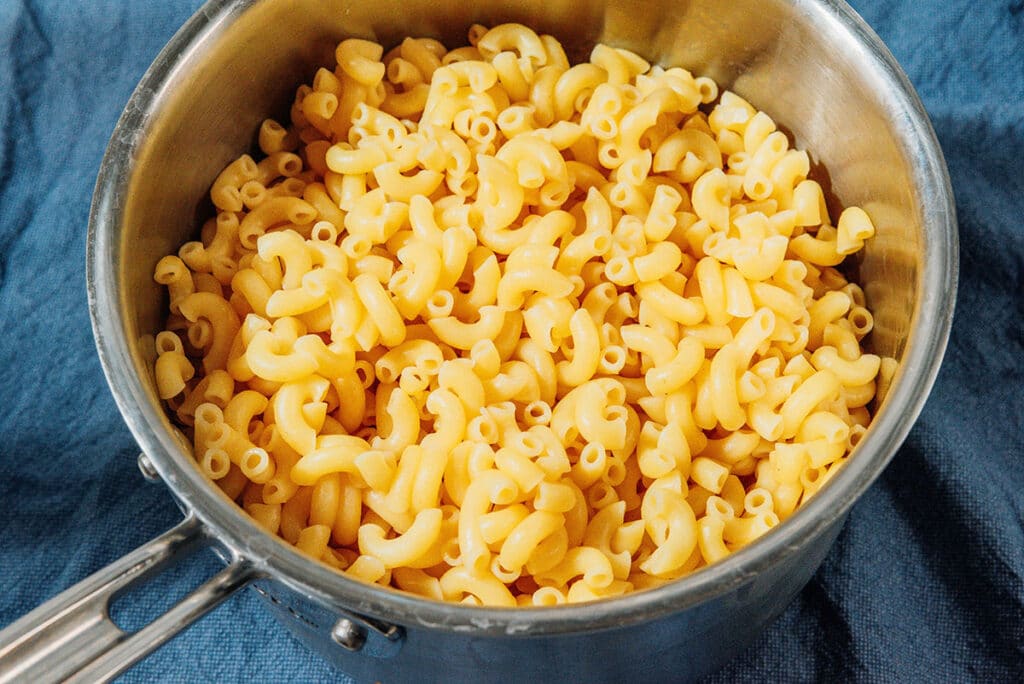 Cooked macaroni in a pot.