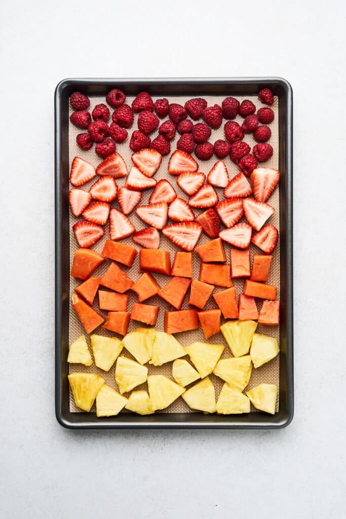 Fruit on a lined baking tray.
