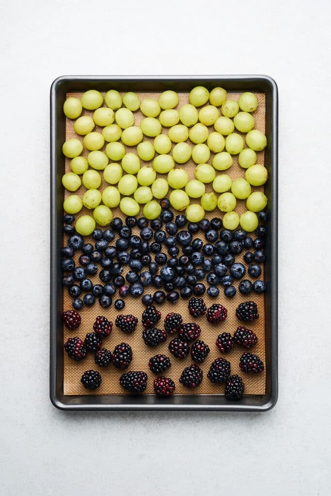 Fruit on a lined baking tray.
