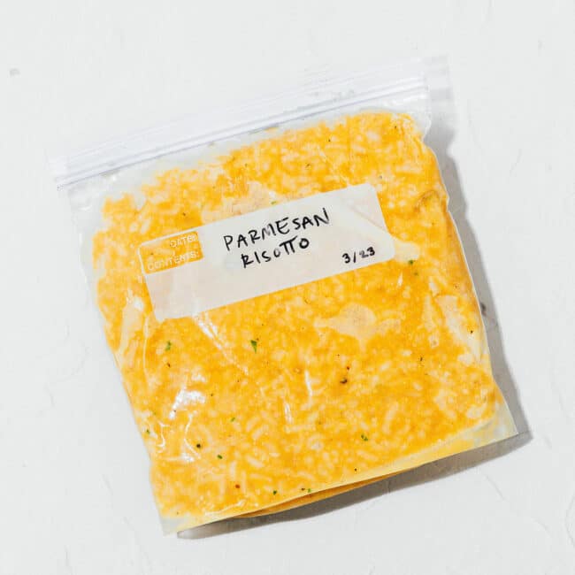 A bag of frozen parmesan risotto on a white background.