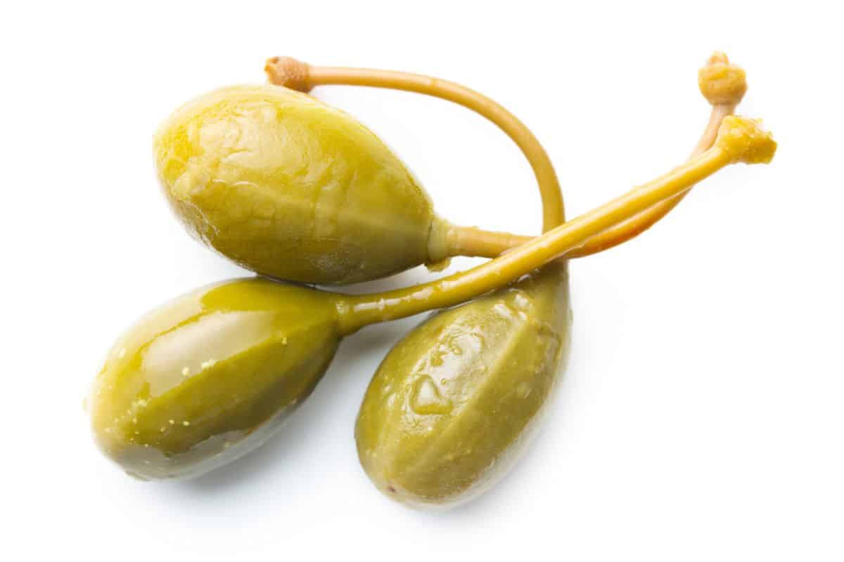 3 capers on a white background.