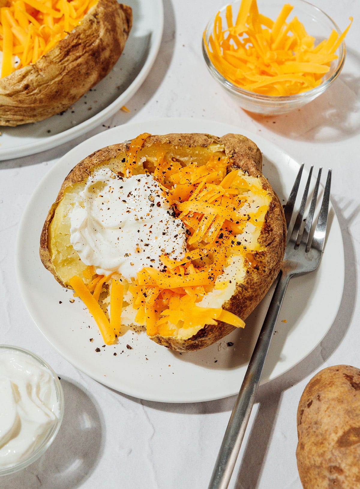 Baked potato with cheese and sour cream.