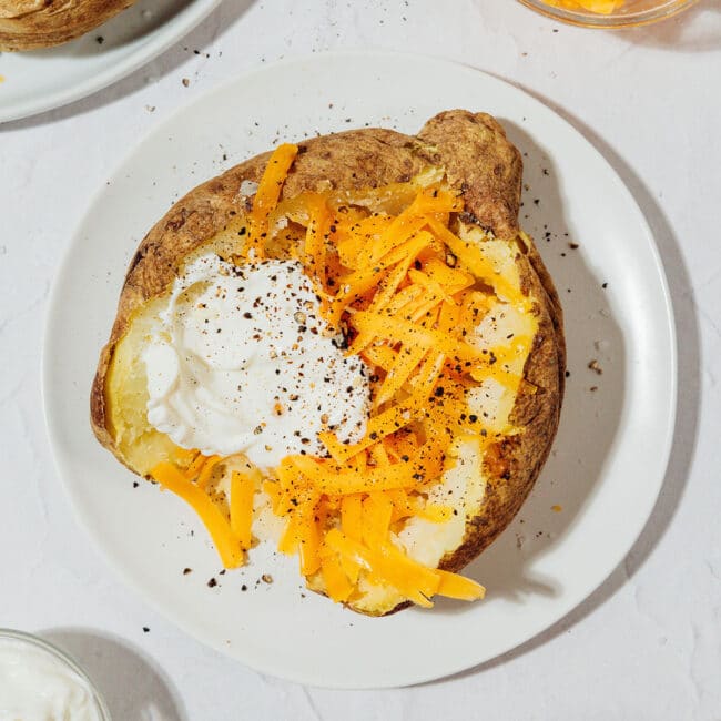 Baked potato with cheese and sour cream.