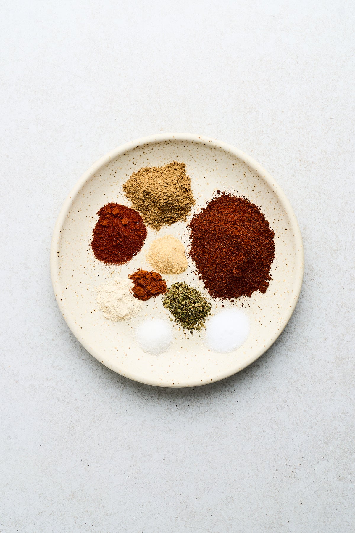 Herbs and spices on a plate.